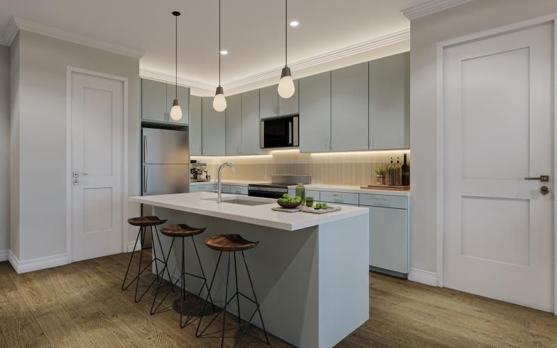 a kitchen with a bar stool and a table