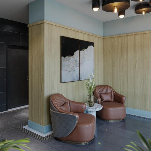 a room with a couch and chairs